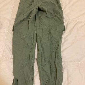 green baggy/paper like pants